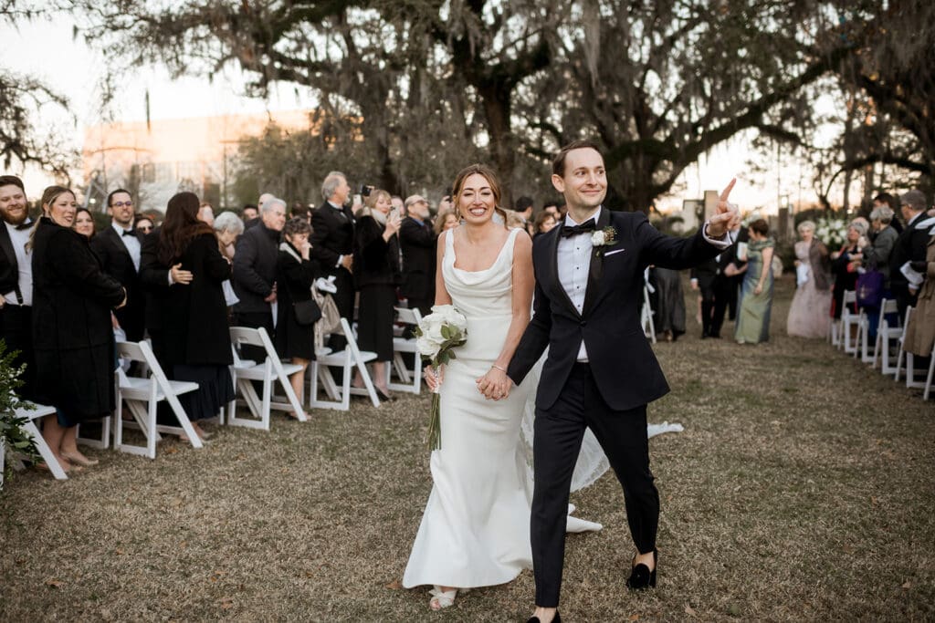 Wedding ceremony processional in New Orleans captured on film by a videographer.