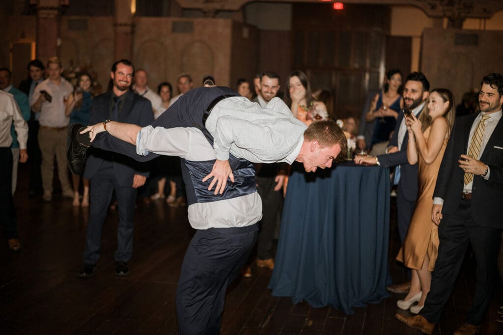 Guests celebrating and dancing on the wedding dance floor.